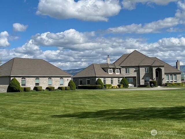 1702 Jb George Rd, Walla Walla, WA 99362 - back of house with a chimney and a lawn