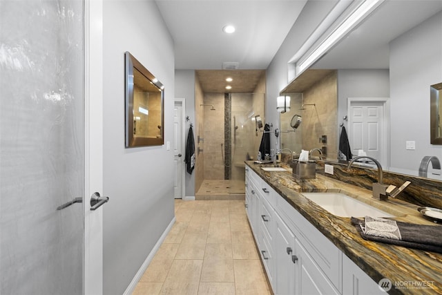 1702 Jb George Rd, Walla Walla, WA 99362 - bathroom featuring a stall shower, double vanity, recessed lighting, tile patterned floors, and baseboards