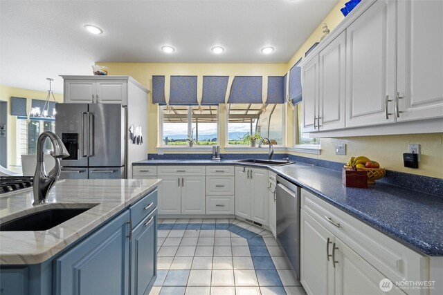 1702 Jb George Rd, Walla Walla, WA 99362 - kitchen featuring appliances with stainless steel finishes, a sink, healthy amount of natural light, and recessed lighting
