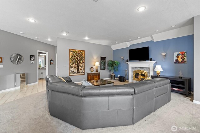1702 Jb George Rd, Walla Walla, WA 99362 - living room featuring a fireplace, recessed lighting, light colored carpet, baseboards, and light tile patterned floors