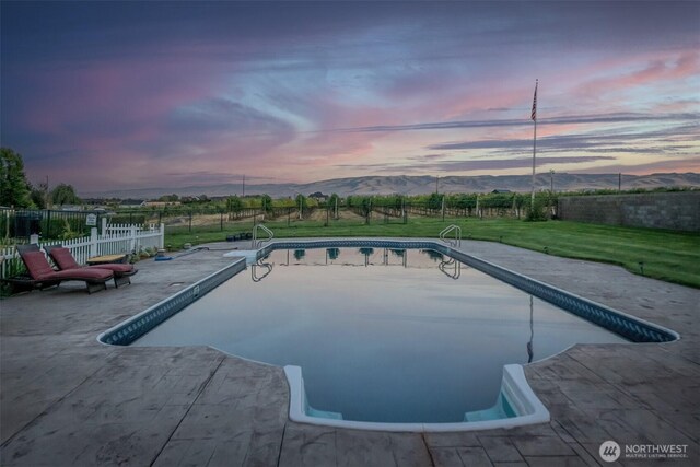 1702 Jb George Rd, Walla Walla, WA 99362 - pool at dusk featuring a patio area and a mountain view