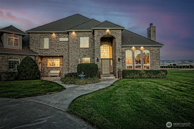 1702 Jb George Rd, Walla Walla, WA 99362 - view of front of home featuring a front lawn, a chimney, and brick siding