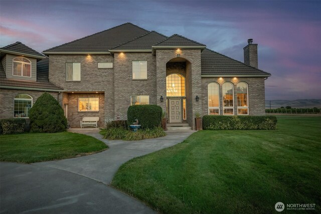 1702 Jb George Rd, Walla Walla, WA 99362 - view of front of property with a front lawn, a chimney, and brick siding