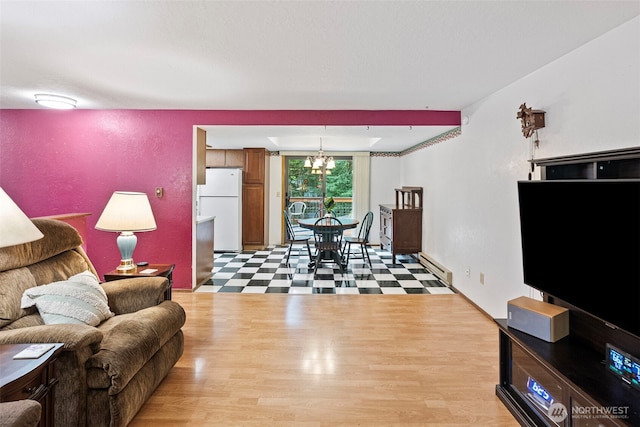 4119 Big Beef Xing NW, Bremerton, WA 98312 - living area featuring light floors, a chandelier, and a baseboard heating unit