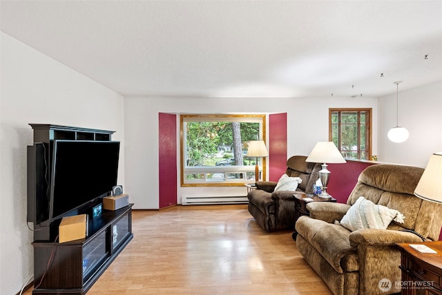 4119 Big Beef Xing NW, Bremerton, WA 98312 - living area featuring baseboard heating, plenty of natural light, and light wood-style flooring