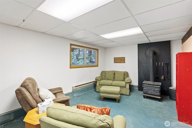 4119 Big Beef Xing NW, Bremerton, WA 98312 - living room with a baseboard heating unit, a wood stove, and a drop ceiling