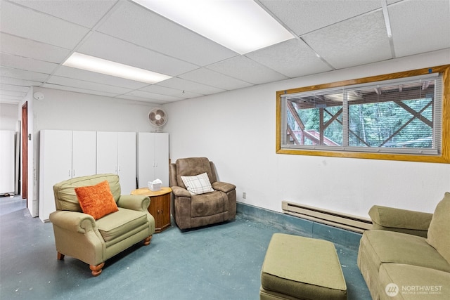 4119 Big Beef Xing NW, Bremerton, WA 98312 - sitting room featuring baseboard heating, a drop ceiling, and finished concrete flooring