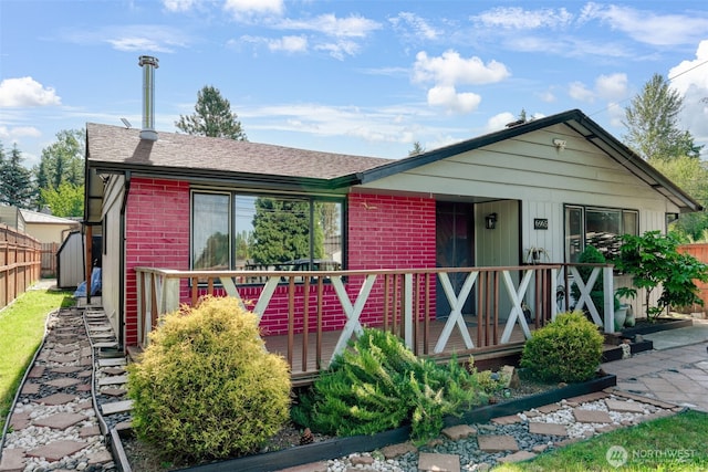 6965E E E, Tacoma, WA 98404 - view of front of property featuring brick siding and roof with shingles
