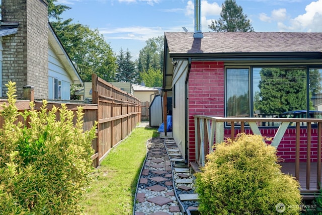 6965E E E, Tacoma, WA 98404 - view of side of home with brick siding and a shingled roof