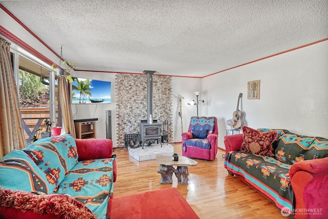 6965E E E, Tacoma, WA 98404 - living area with a wood stove, wood finished floors, a textured ceiling, and crown molding