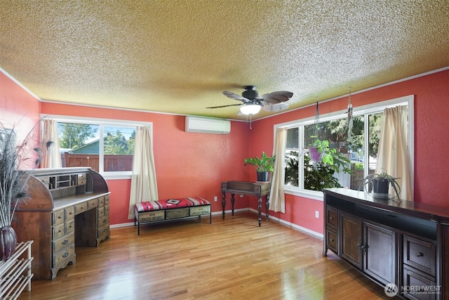 6965E E E, Tacoma, WA 98404 - living area with a wall unit AC, a textured ceiling, light wood-style floors, a ceiling fan, and ornamental molding