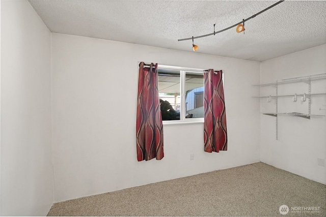 6965E E E, Tacoma, WA 98404 - spare room featuring carpet floors and a textured ceiling