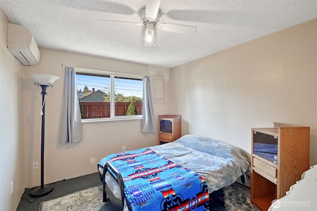 6965E E E, Tacoma, WA 98404 - bedroom with carpet flooring, an AC wall unit, a textured ceiling, and a ceiling fan