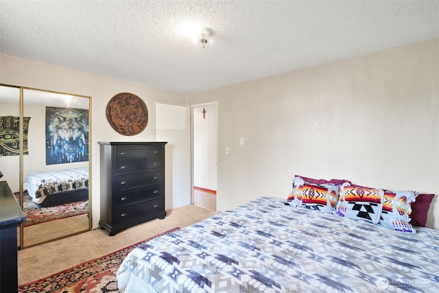 6965E E E, Tacoma, WA 98404 - bedroom featuring carpet flooring, a closet, and a textured ceiling