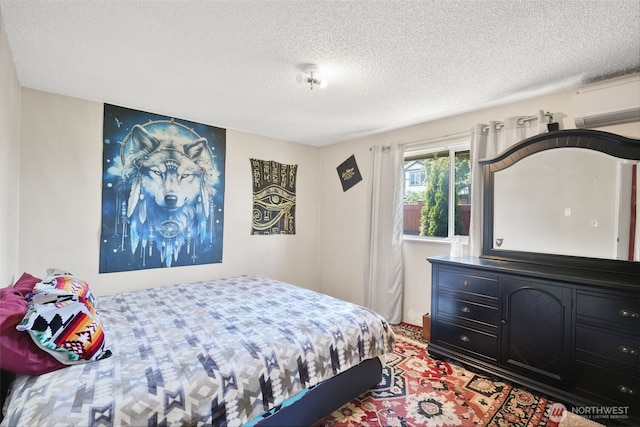6965E E E, Tacoma, WA 98404 - bedroom featuring an AC wall unit and a textured ceiling