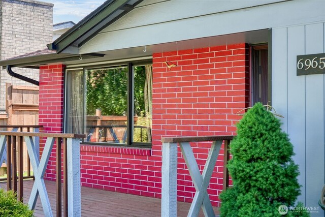 6965E E E, Tacoma, WA 98404 - property entrance featuring brick siding and a chimney