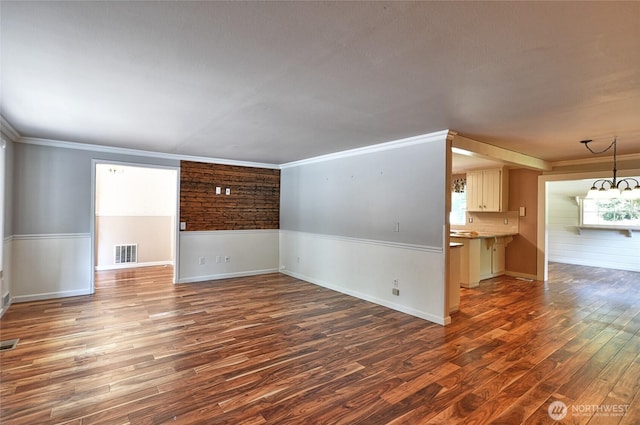 26025 Tronson Rd, Arlington, WA 98223 - spare room featuring wood finished floors, crown molding, and baseboards