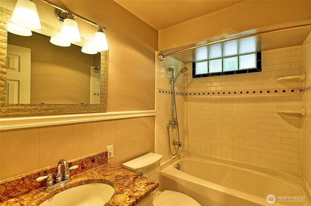 26025 Tronson Rd, Arlington, WA 98223 - bathroom with bathing tub / shower combination, toilet, vanity, and wainscoting
