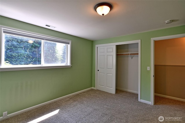 26025 Tronson Rd, Arlington, WA 98223 - unfurnished bedroom with a closet, carpet flooring, and baseboards