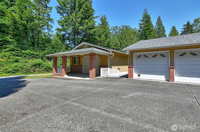 26025 Tronson Rd, Arlington, WA 98223 - view of front of property with brick siding and a garage