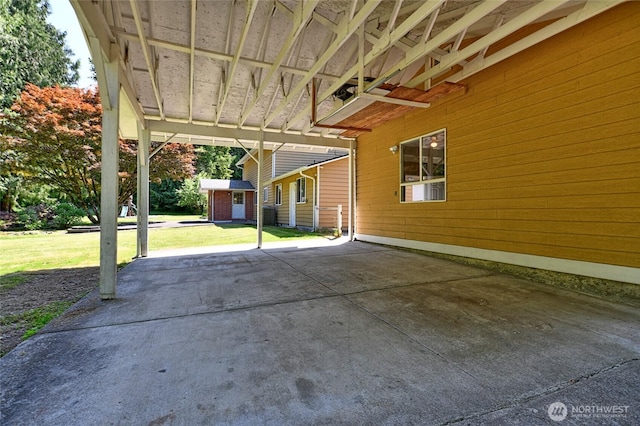26025 Tronson Rd, Arlington, WA 98223 - view of patio featuring a carport and an outbuilding