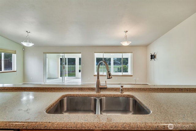 546 Canal Dr NE, Ocean Shores, WA 98569 - kitchen with a sink, plenty of natural light, and hanging light fixtures
