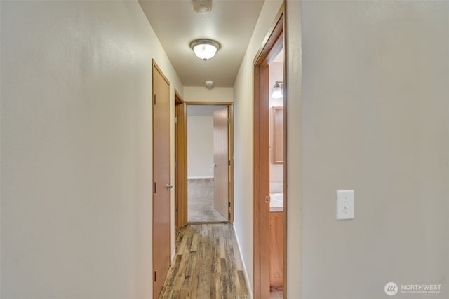 546 Canal Dr NE, Ocean Shores, WA 98569 - corridor featuring light wood finished floors and baseboards