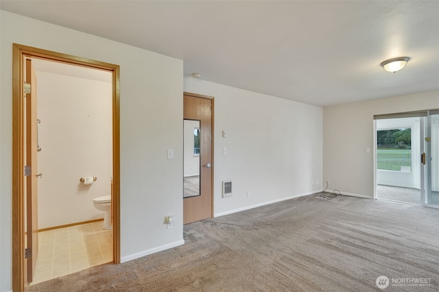 546 Canal Dr NE, Ocean Shores, WA 98569 - carpeted empty room with baseboards and heating unit