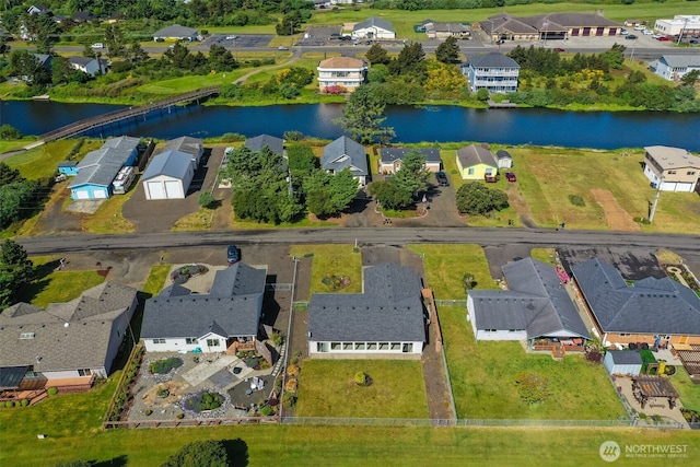 546 Canal Dr NE, Ocean Shores, WA 98569 - aerial overview of property's location featuring a large body of water and nearby suburban area
