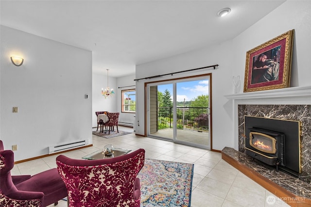 17440 NE 38th St Unit A302, Redmond, WA 98052 - tiled living room featuring baseboard heating, a chandelier, a wood stove, and baseboards