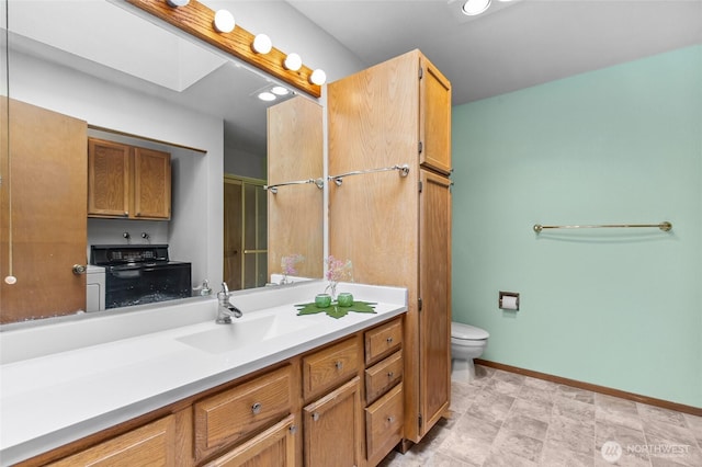 17440 NE 38th St Unit A302, Redmond, WA 98052 - full bath with toilet, vanity, and baseboards
