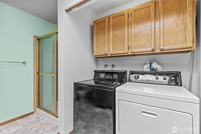 17440 NE 38th St Unit A302, Redmond, WA 98052 - laundry area with washing machine and clothes dryer, cabinet space, and baseboards