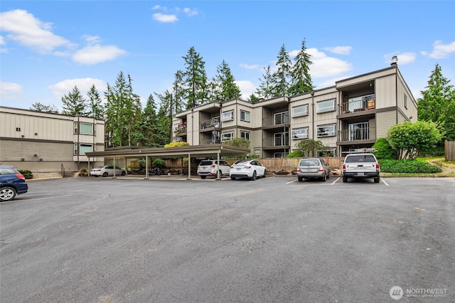 17440 NE 38th St Unit A302, Redmond, WA 98052 - view of apartment building / complex with covered and uncovered parking
