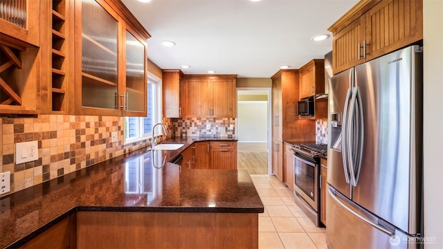 1931 237th St SE, Bothell, WA 98021 - kitchen with stainless steel appliances, light tile patterned floors, tasteful backsplash, glass insert cabinets, and dark stone counters