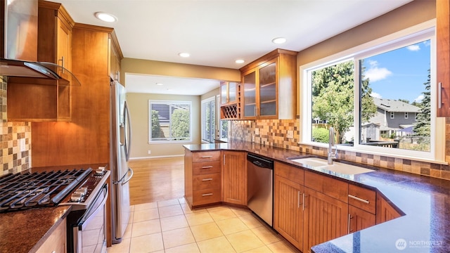 1931 237th St SE, Bothell, WA 98021 - kitchen featuring wall chimney exhaust hood, stainless steel appliances, brown cabinets, backsplash, and recessed lighting