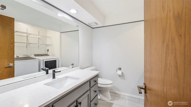 1931 237th St SE, Bothell, WA 98021 - bathroom featuring washing machine and dryer, vanity, and recessed lighting