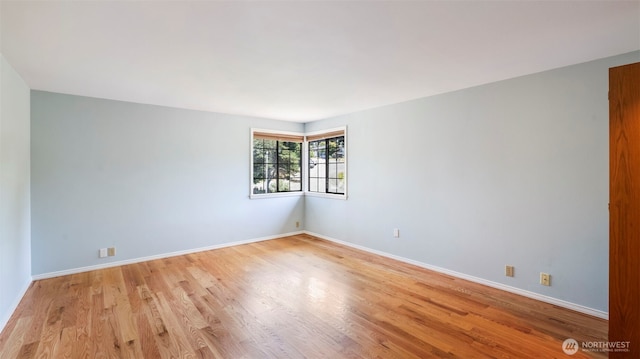 1931 237th St SE, Bothell, WA 98021 - spare room featuring light wood-style floors and baseboards