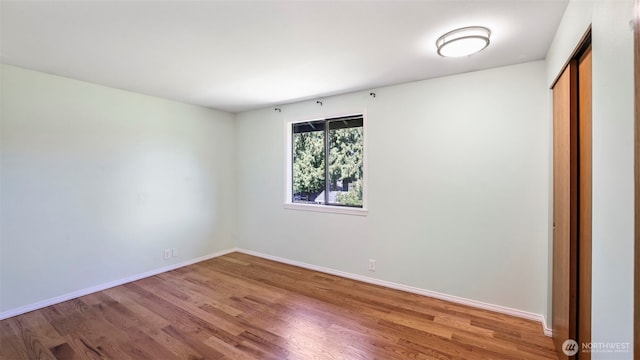 1931 237th St SE, Bothell, WA 98021 - unfurnished bedroom with wood finished floors and a closet