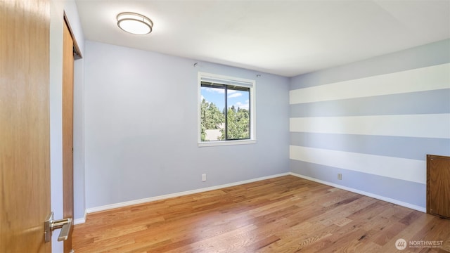 1931 237th St SE, Bothell, WA 98021 - spare room featuring wood finished floors and baseboards