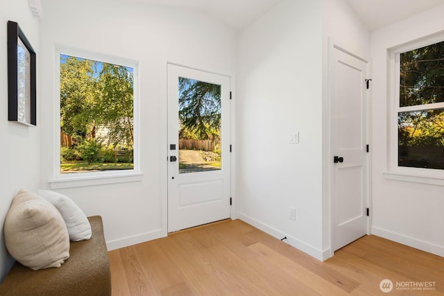 5613 43rd Ave NE, Seattle, WA 98105 - entryway with light wood finished floors, plenty of natural light, and baseboards