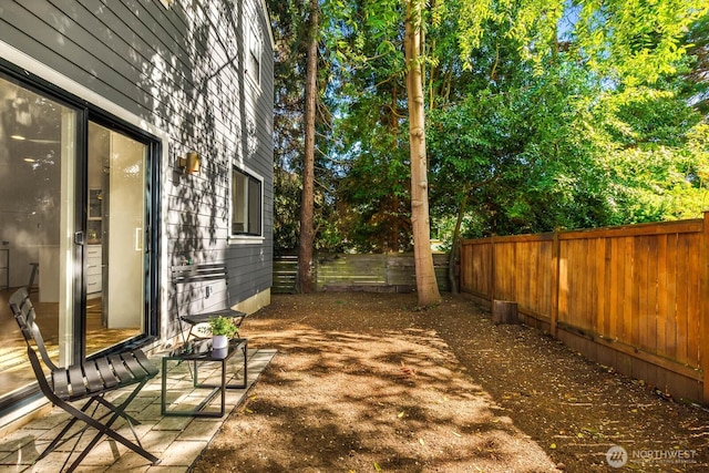 5613 43rd Ave NE, Seattle, WA 98105 - fenced backyard featuring view of wooded area