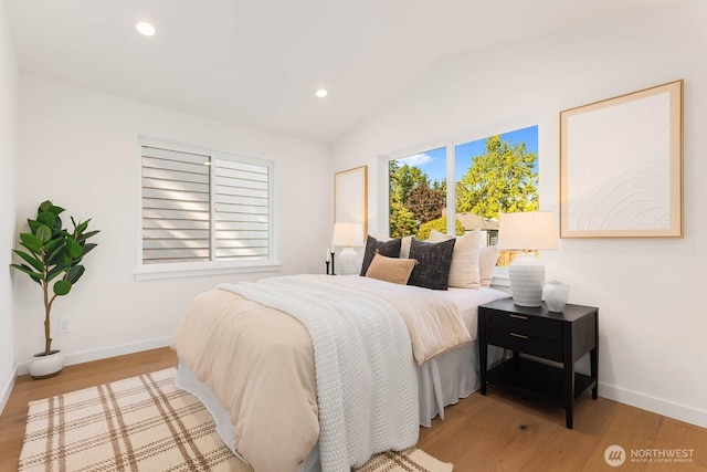 5613 43rd Ave NE, Seattle, WA 98105 - bedroom with light wood-style floors, lofted ceiling, baseboards, and recessed lighting