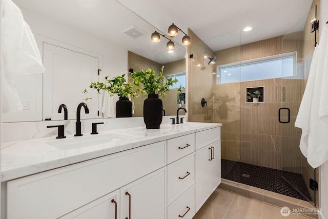 5613 43rd Ave NE, Seattle, WA 98105 - full bath with double vanity, a shower stall, and tile patterned flooring