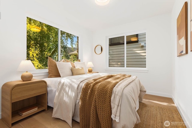 5613 43rd Ave NE, Seattle, WA 98105 - bedroom with baseboards and wood finished floors
