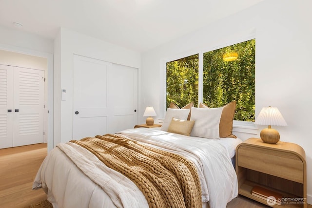 5613 43rd Ave NE, Seattle, WA 98105 - bedroom with wood finished floors and a closet