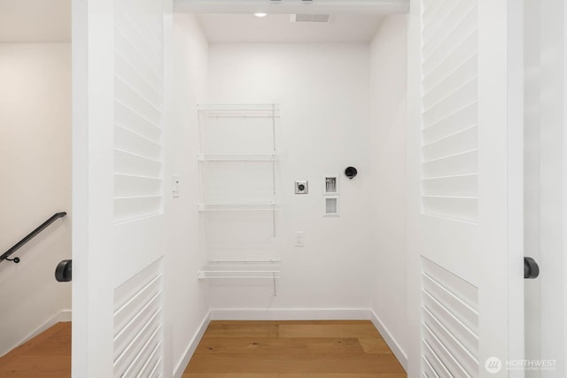 5613 43rd Ave NE, Seattle, WA 98105 - washroom with electric dryer hookup, light wood-style floors, washer hookup, and baseboards