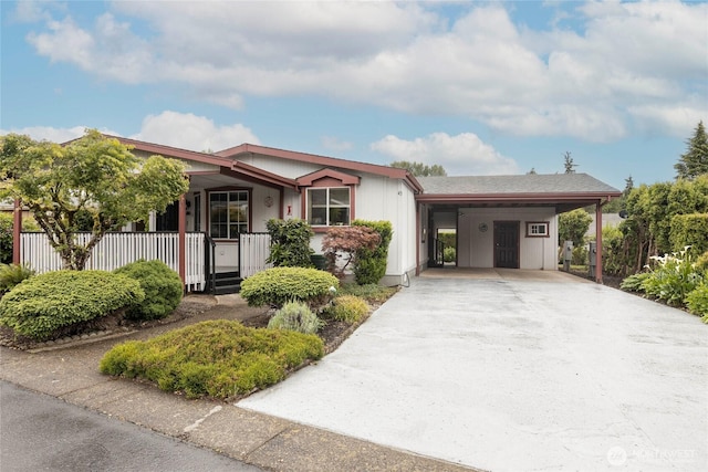 5701 NE St Johns Rd Unit 43, Vancouver, WA 98661 - view of front of house with a porch, concrete driveway, and a carport