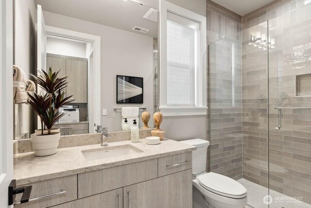 215 8th Ave W, Kirkland, WA 98033 - bathroom with toilet, vanity, and a shower stall