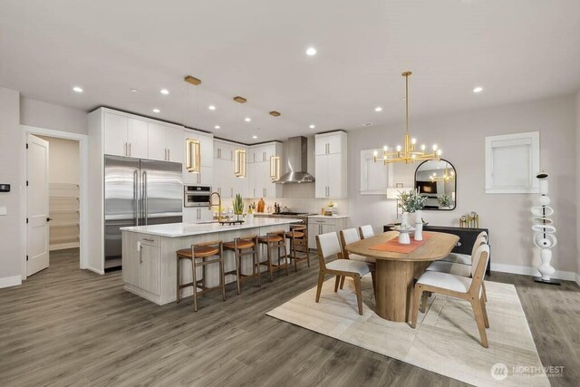 215 8th Ave W, Kirkland, WA 98033 - dining room featuring recessed lighting, wood finished floors, a chandelier, and baseboards