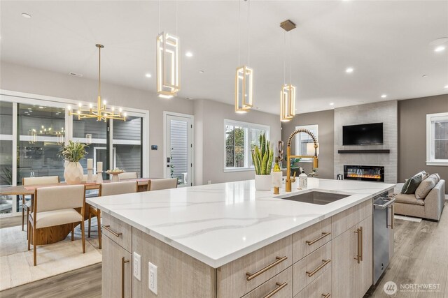 215 8th Ave W, Kirkland, WA 98033 - kitchen with light brown cabinets, open floor plan, a sink, dishwasher, and recessed lighting